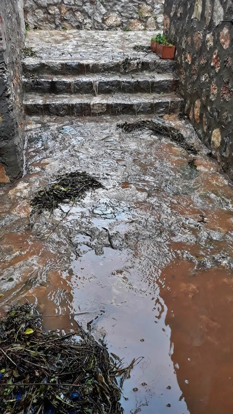 Flood water pouring down the steps and basically into our house.