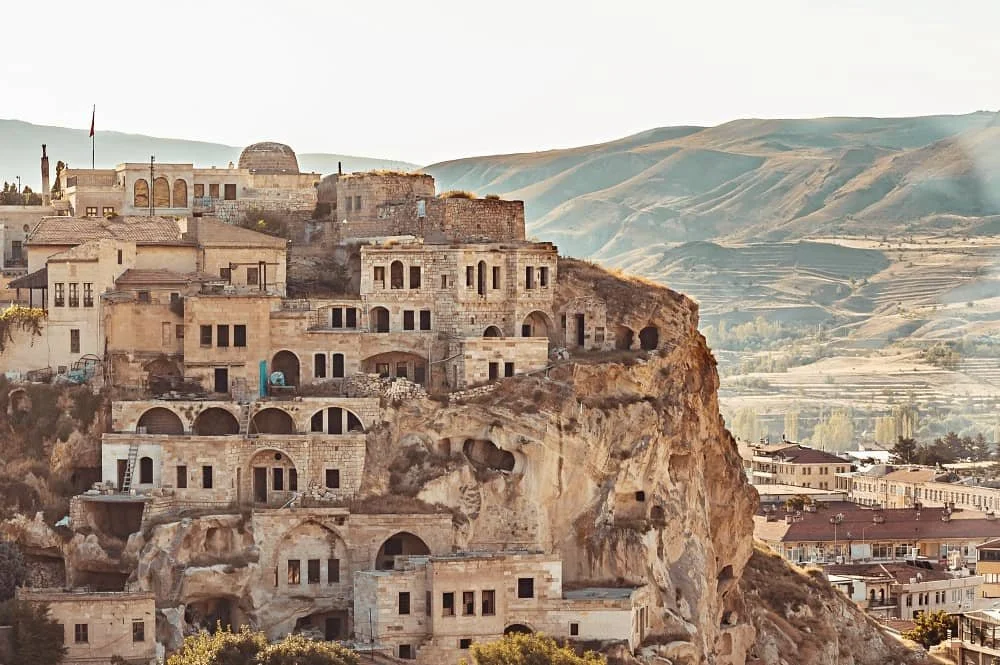 Stone houses cascade down Temenni Tepesi (Wish Hill) in Urgup in Cappadocia, where to stay in cappadocia urgup or goreme