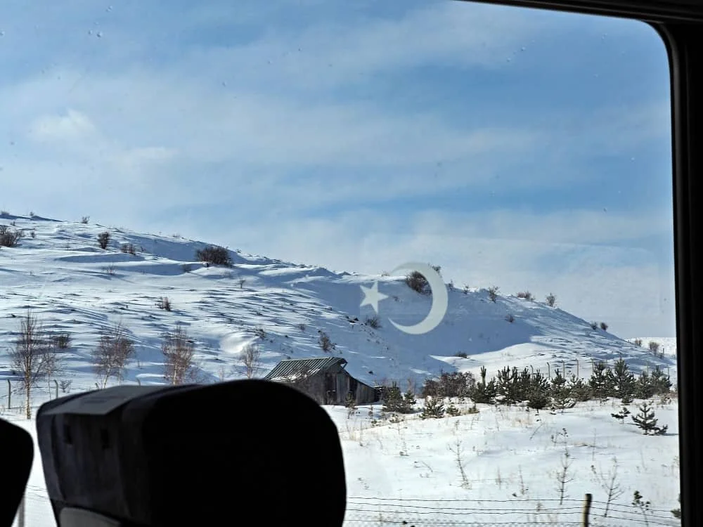 Snowy mountain views as seen from the window of the Eastern Express, tourist train ankara to kars