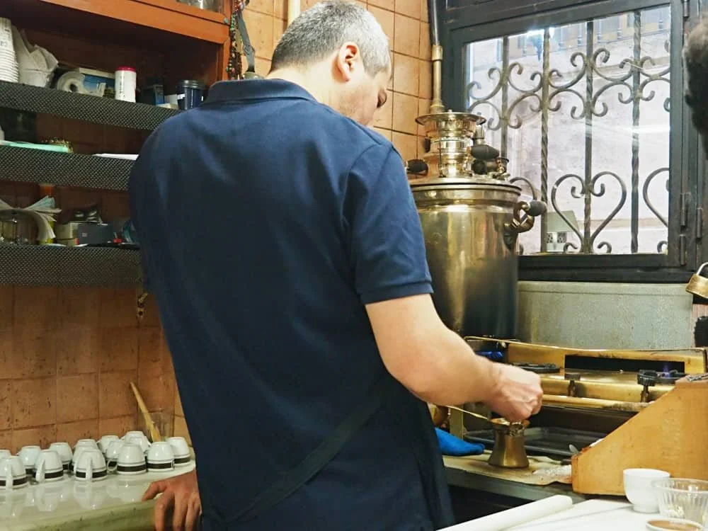 A man prepares a cup of Turkish coffee at Mandabatmaz in Istanbul