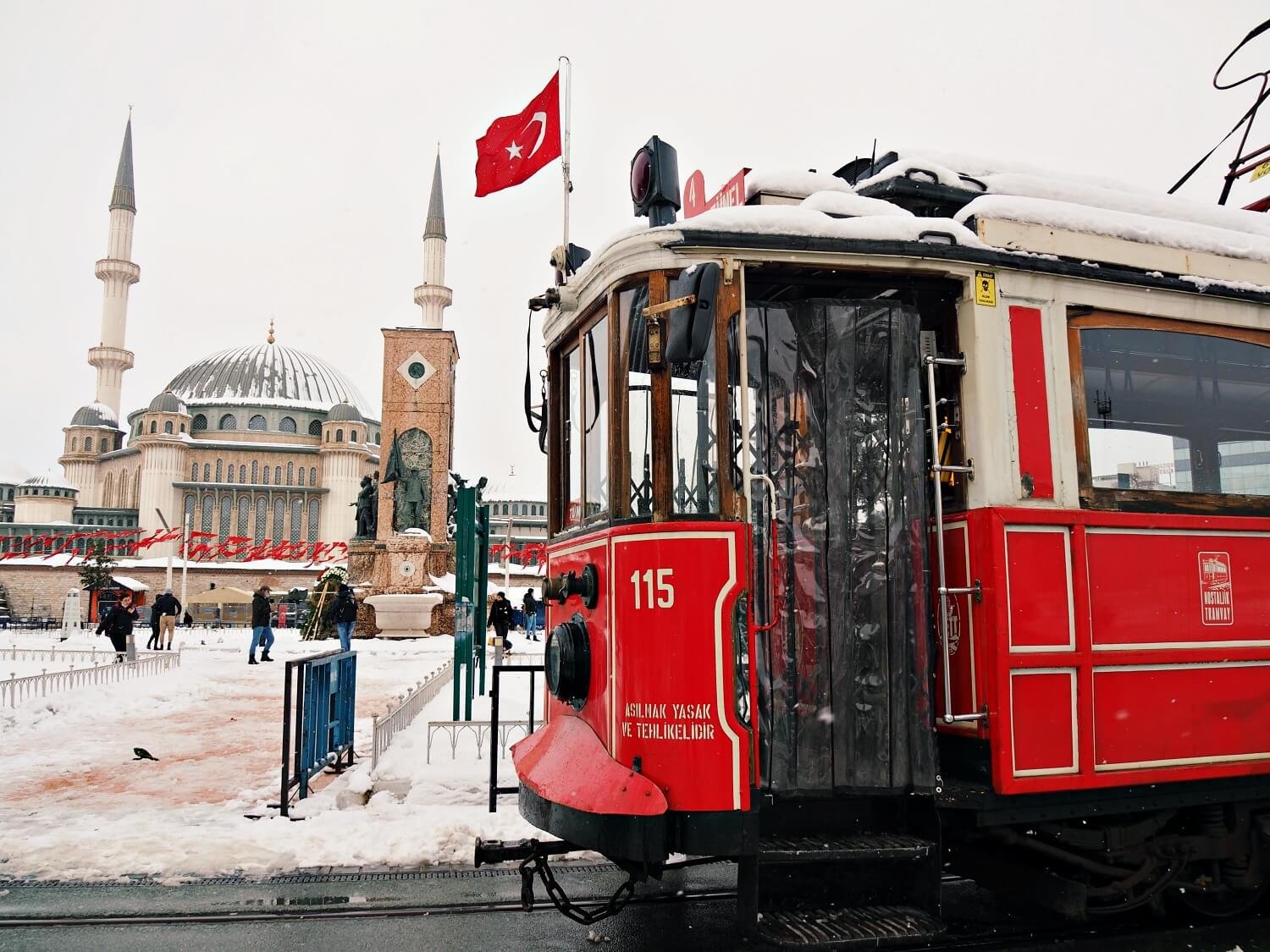 December weather in Istanbul - Taksim Square and the tram covered in snow