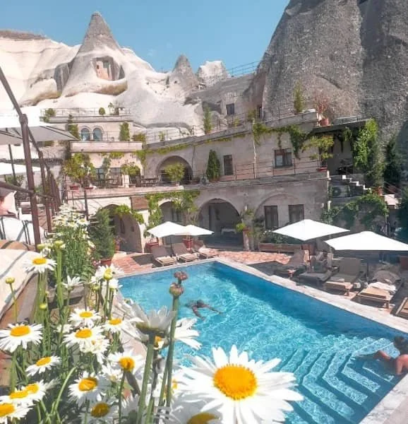 Swimming pool surrounded by fairy chimneys at Local Cave House Hotel, where to stay in goreme cappadocia