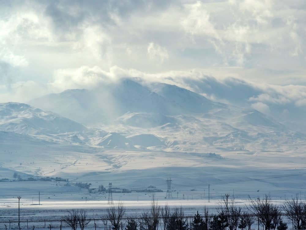 Snowy mountain scenery from the window of the train to kars turkey