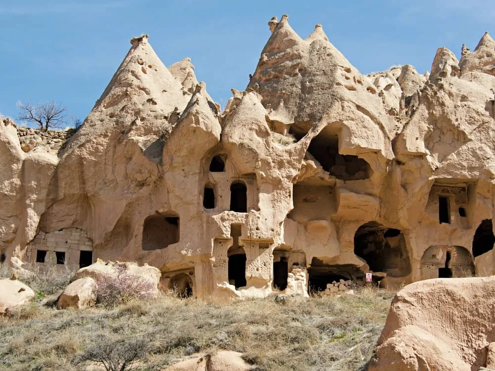 a monastery carved into rock at Zelve Open Air Museum
