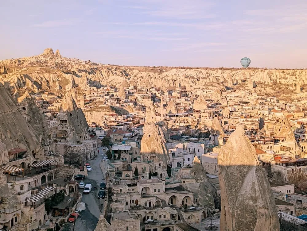 View over the fairy chimneys and cave hotels in Goreme just after sunrise, where to stay cappadocia