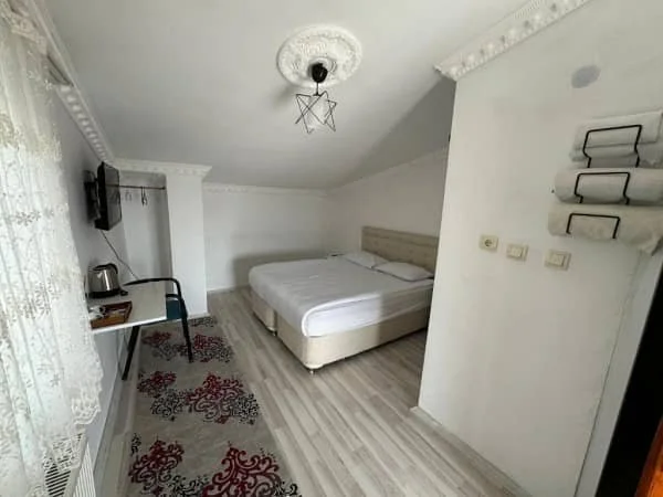 A bright comfortable bedroom at Gumus Hotel in Ortahisar