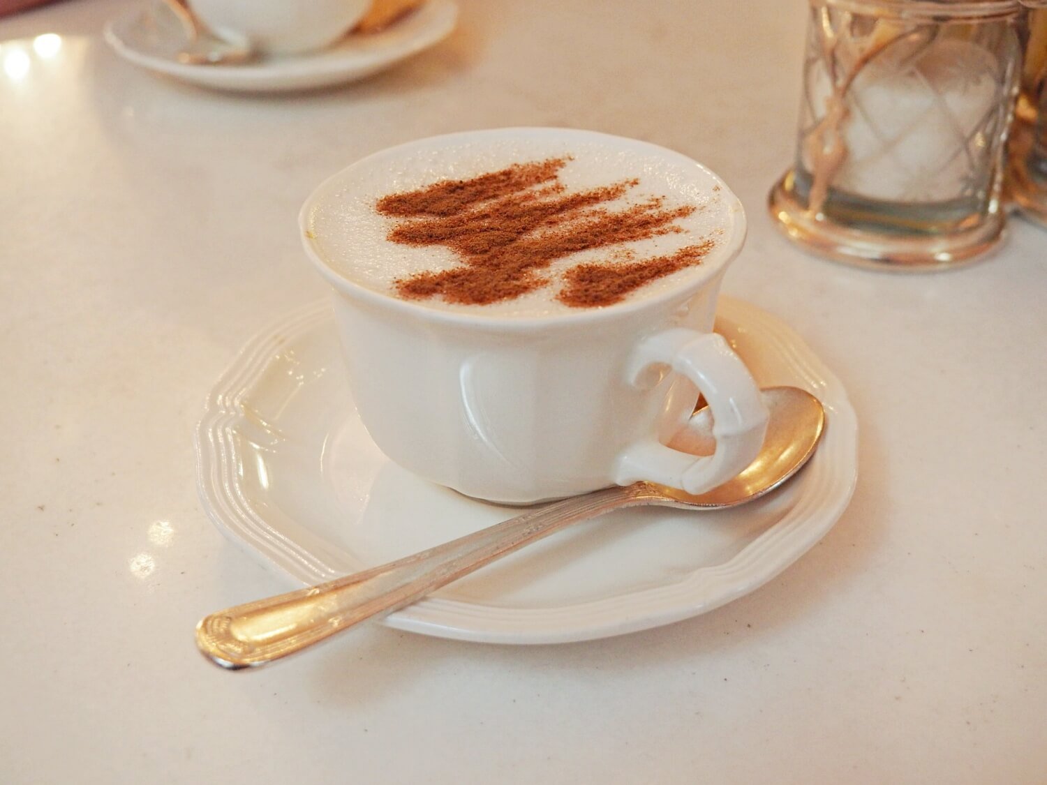 A tea cup of salep with cinnamon sprinkled on top, winter drinks in Istanbul