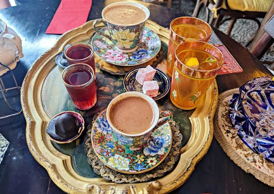 A tray of Turkish coffee with Turkish delight, sweets and sweet red wine in Istanbul