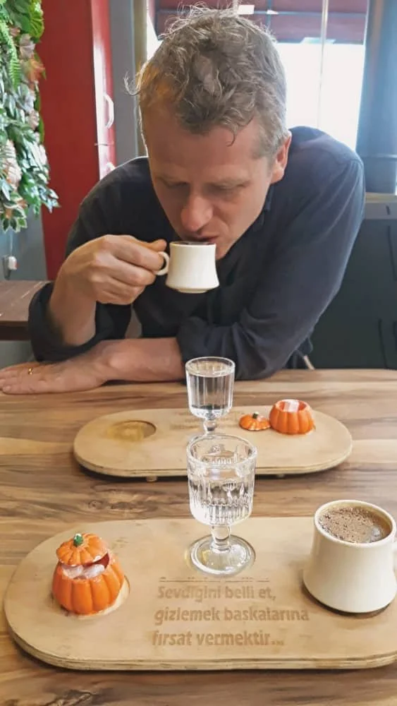 Vincent drinks a cup of Turkish coffee at a cafe in Istanbul