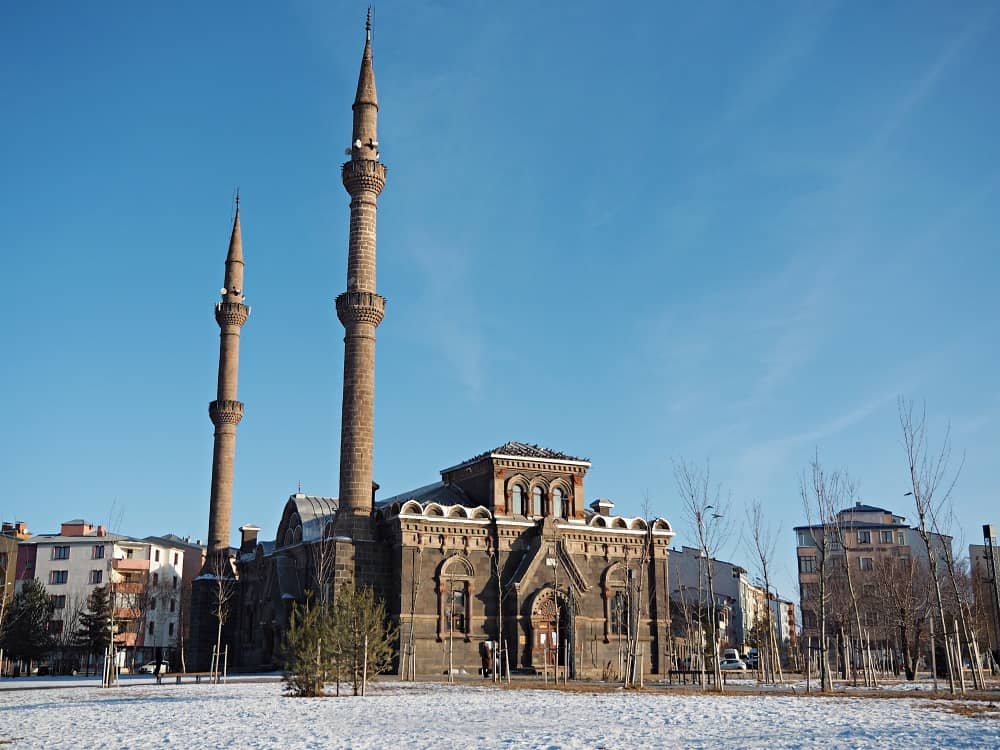 A Russian style mosque in Kars Turkey against a blue sky