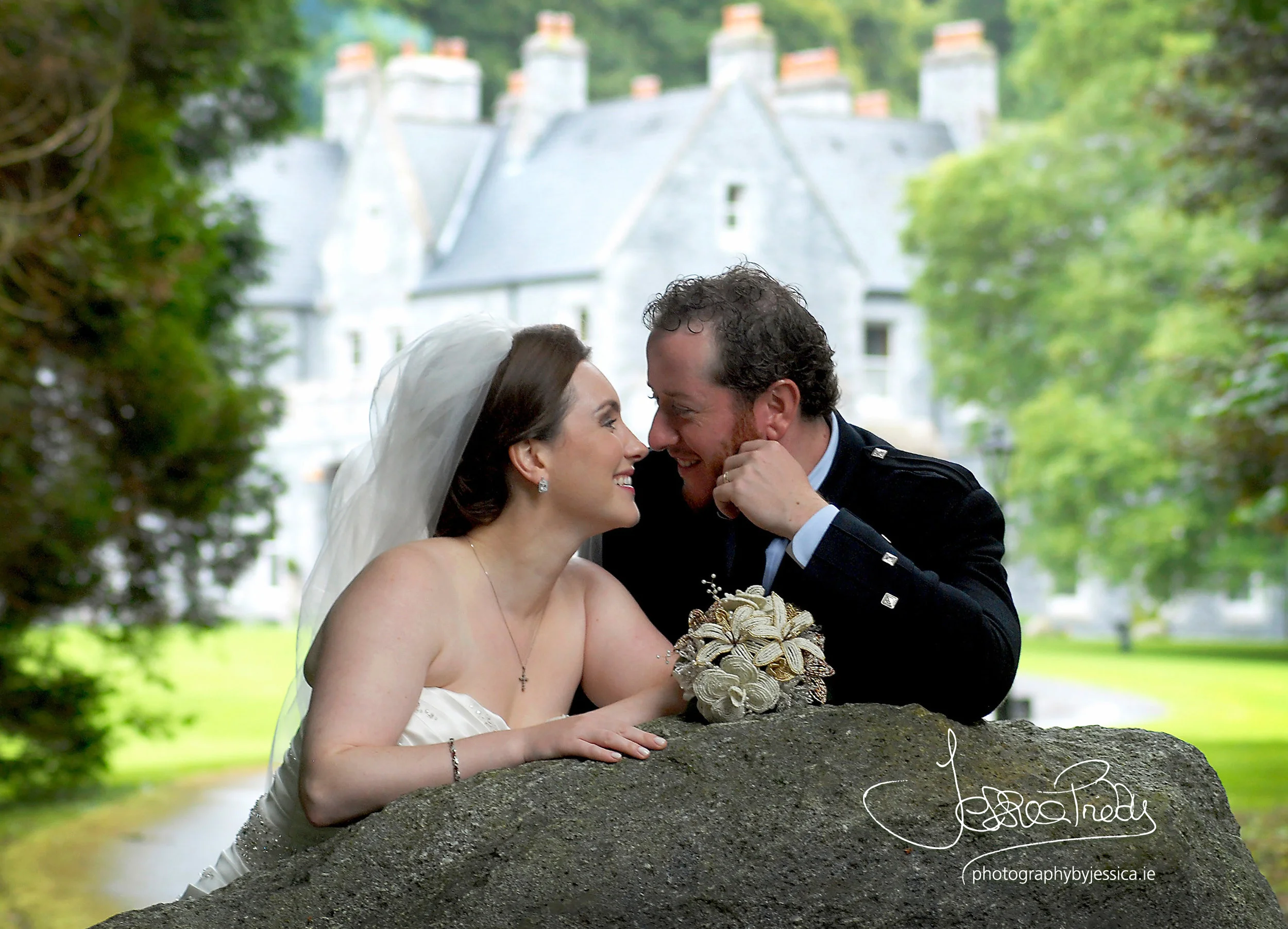 Bride and Groom in front of their Wedding Venue
