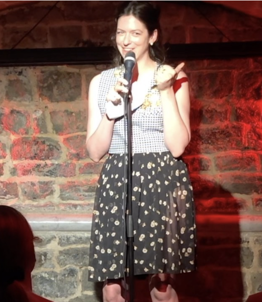 Jessie doing stand-up comedy