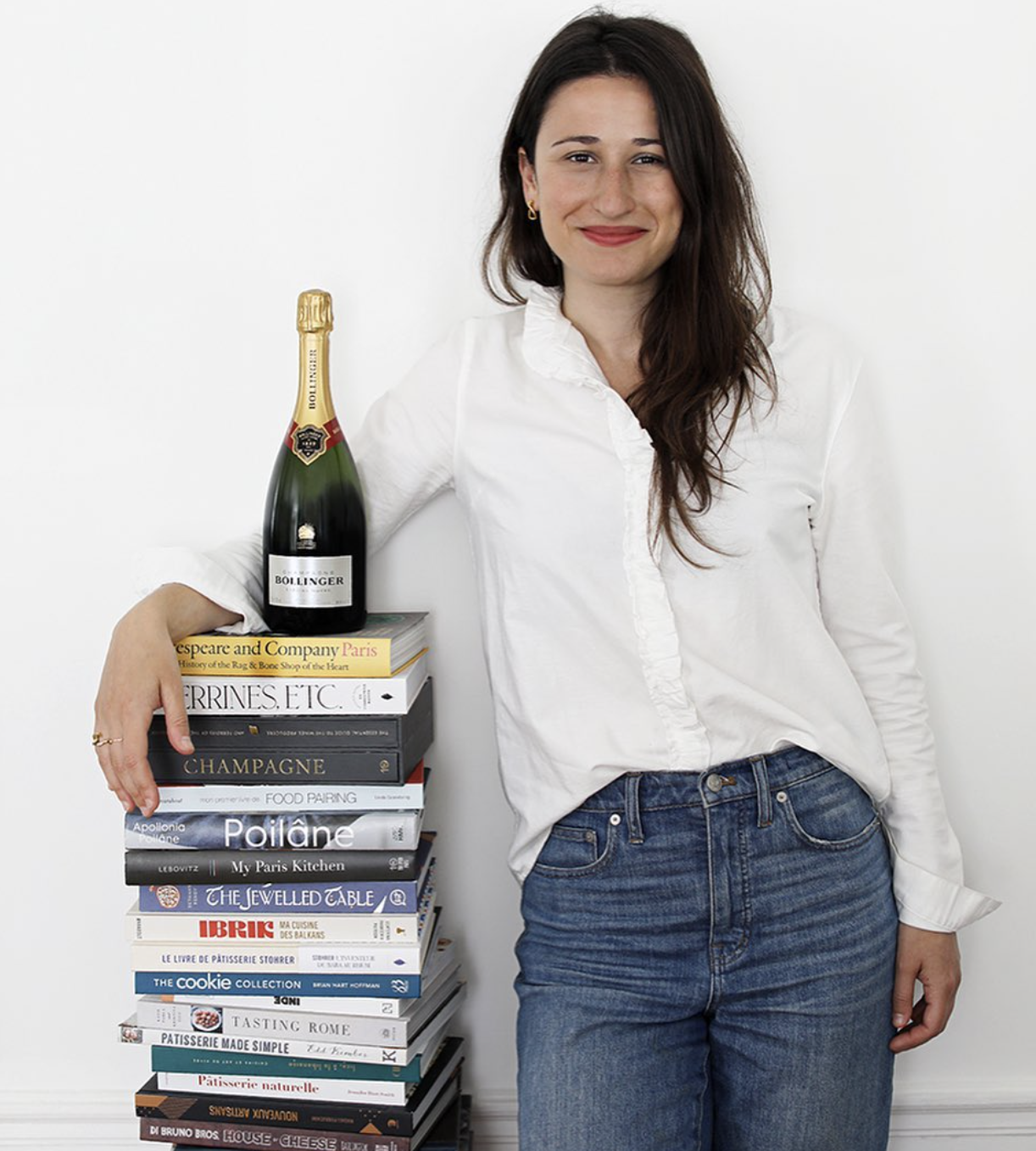 Lindsey with Champagne and books