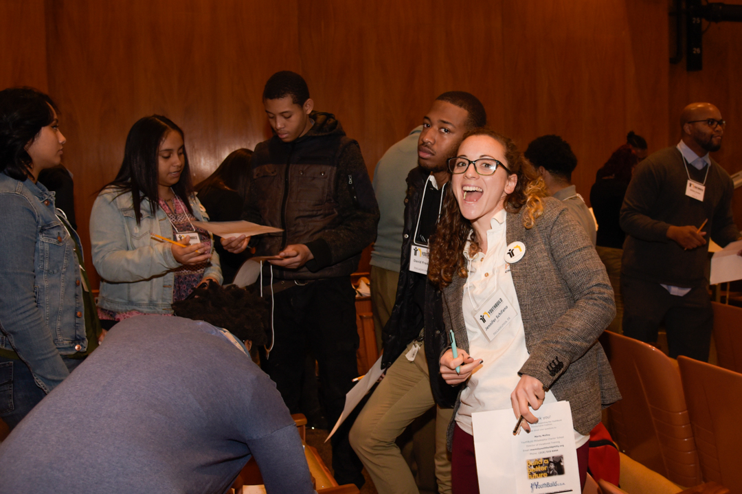 Students and staff participating in a team-building icebreaker