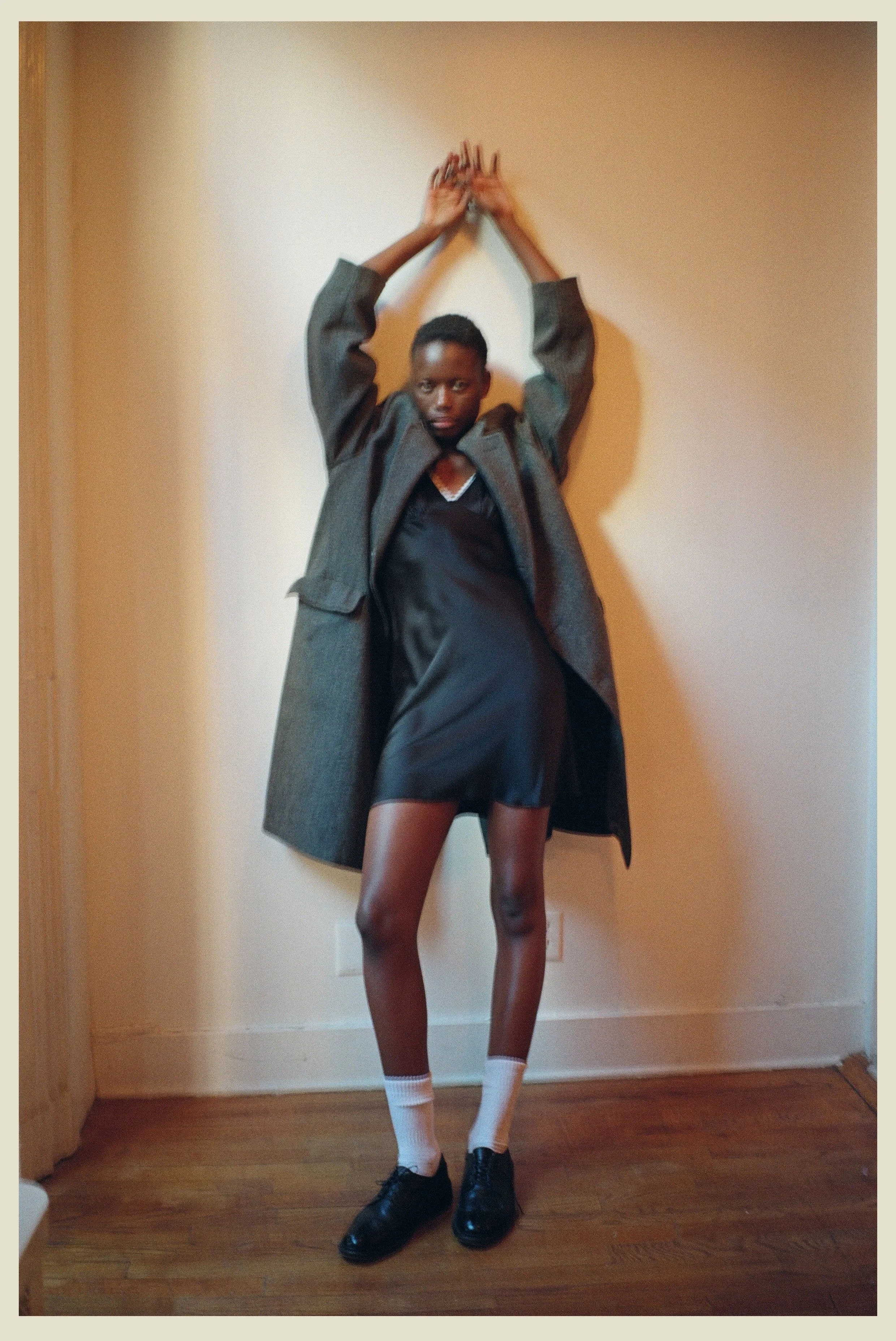 blackdress_armsup_border.jpg