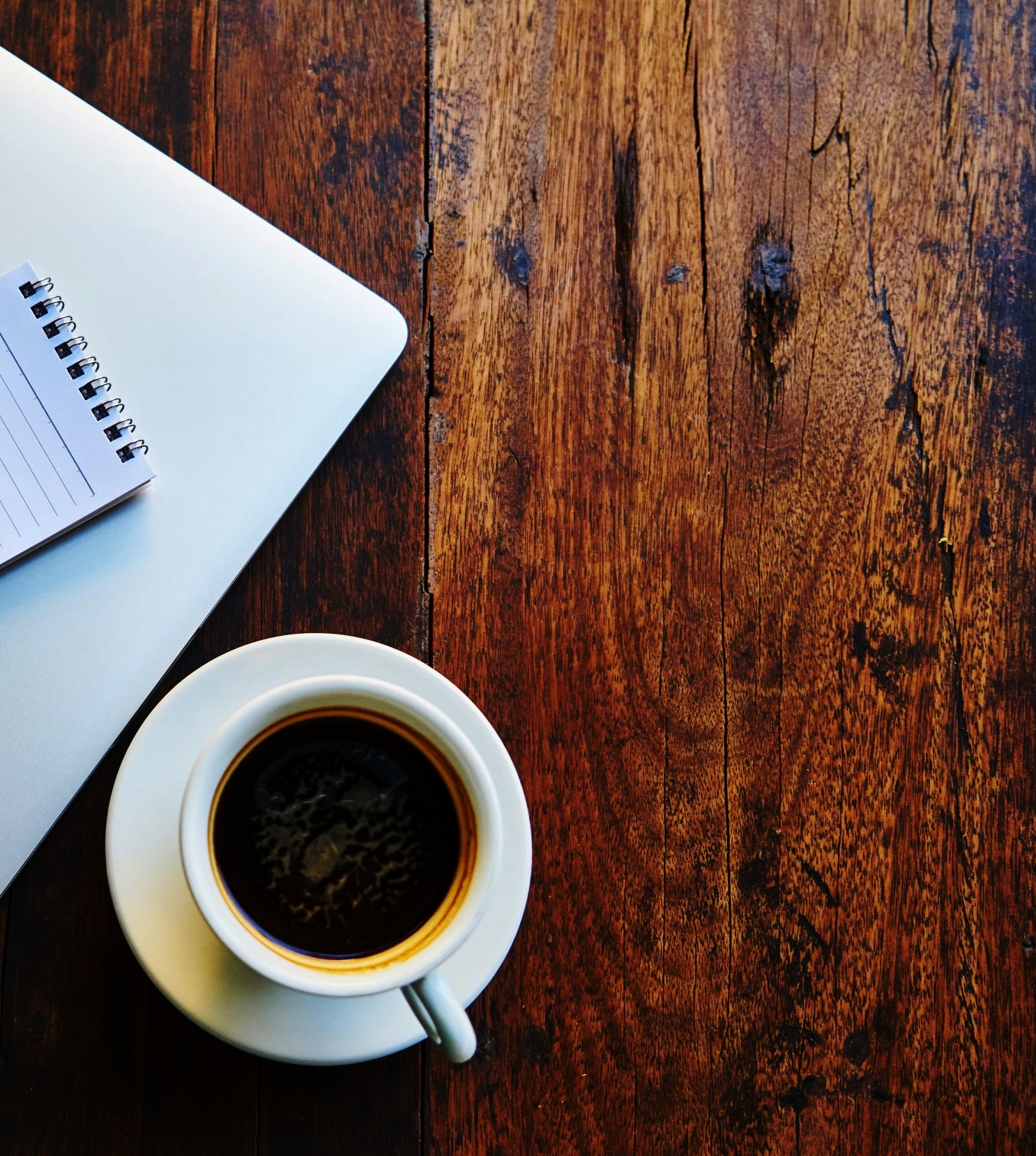 Brown desk with coffee and computer.jpeg