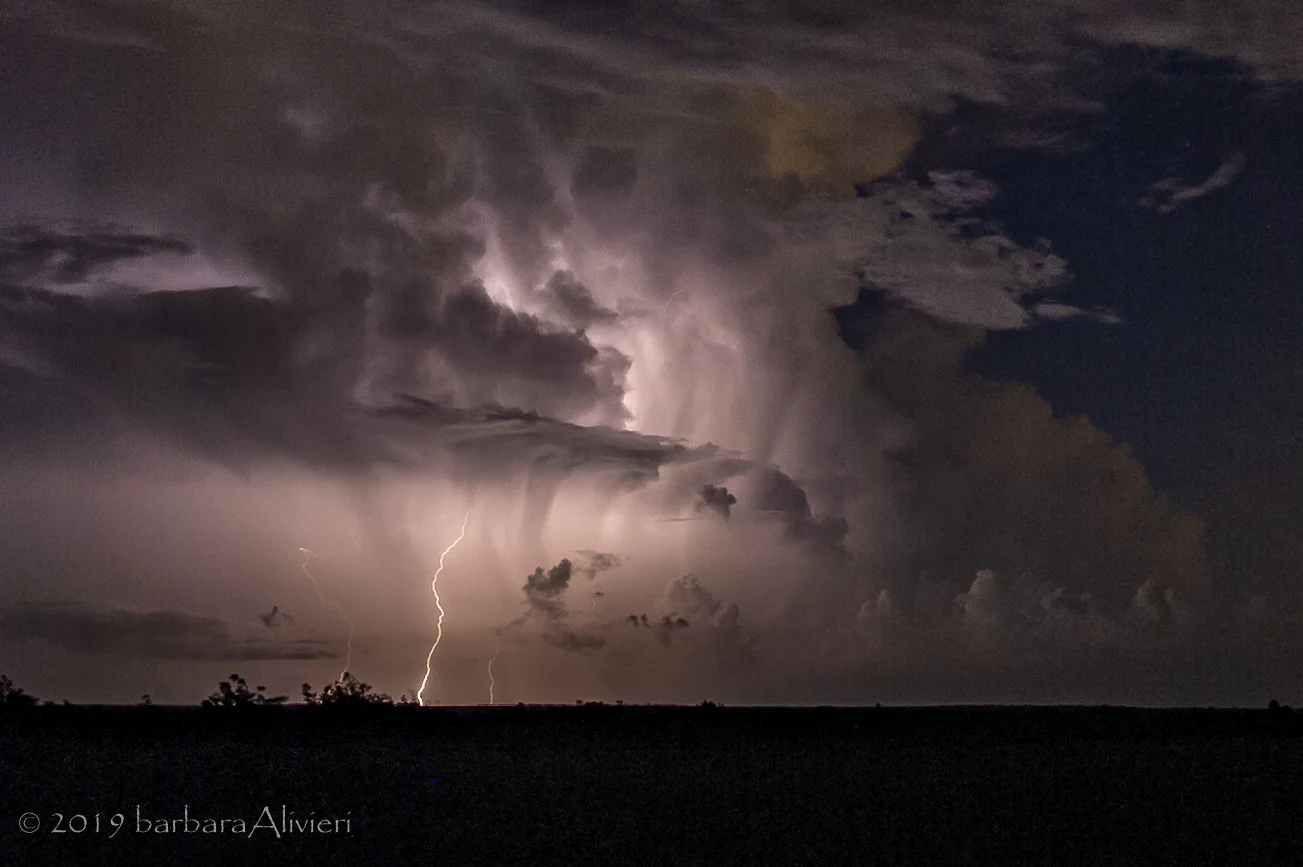 Love this, beautiful clouds and multiple lighting strikes.