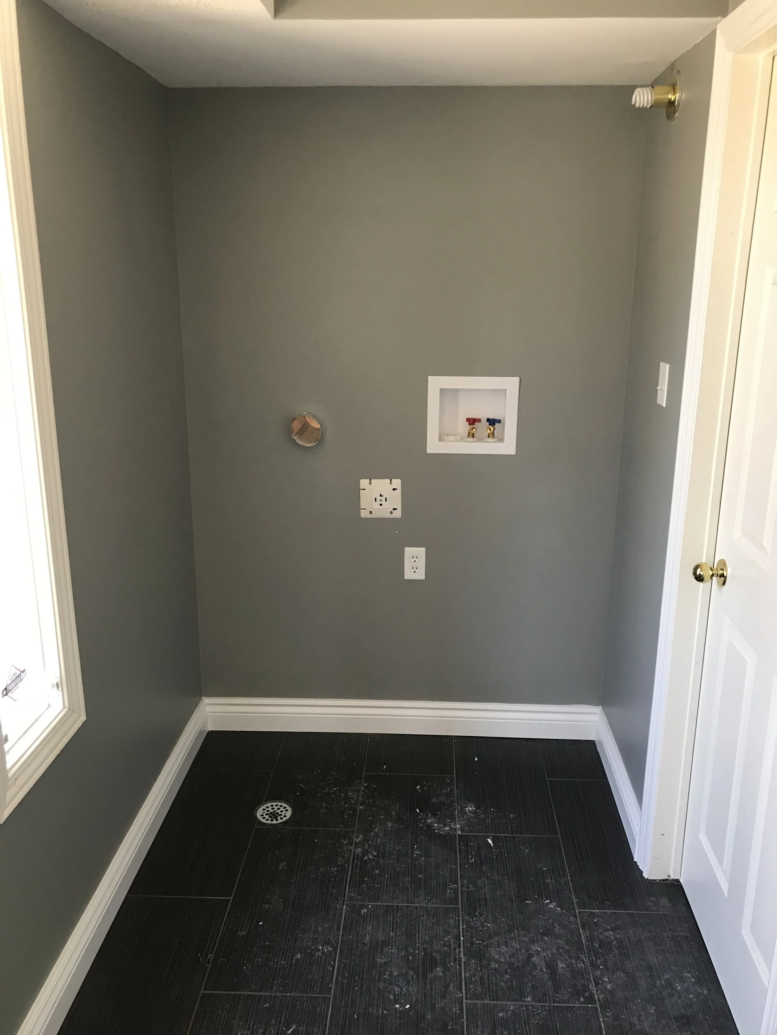 Main floor laundry and floor tile Reno 