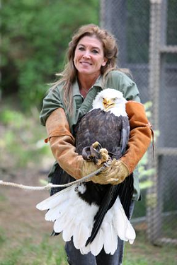 Photo: Jane Veltkamp and Beauty the Bald Eagle. Photo Credit: Glen Hush.