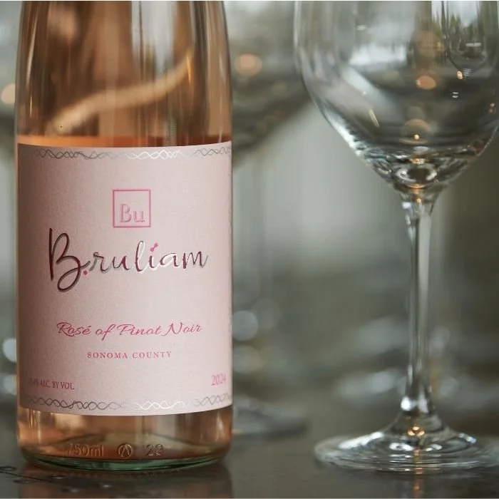 bottle of rose wine with wine glass