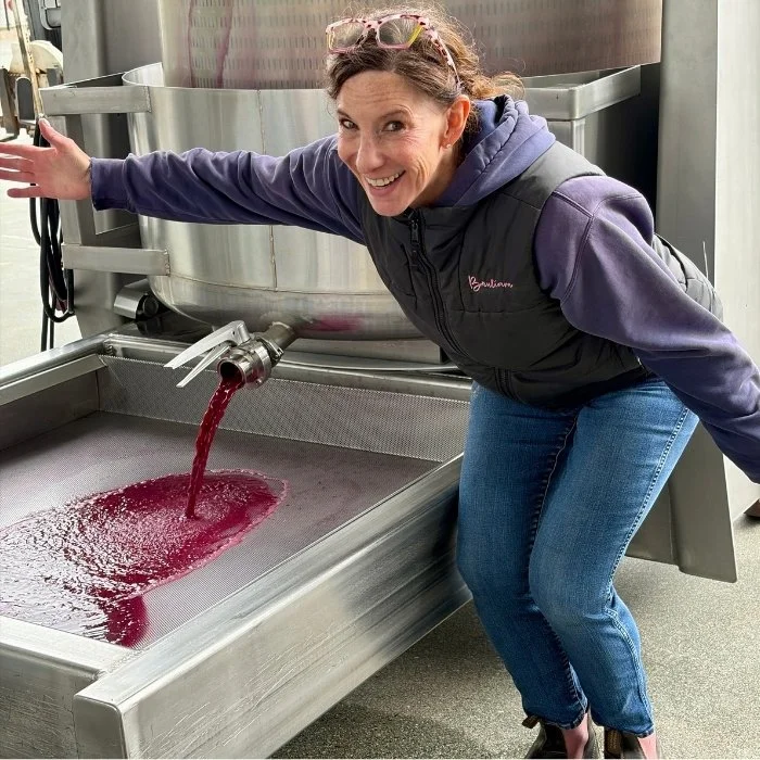 winemaker posing at basket press