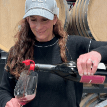 Cheers pouring a glass of wine