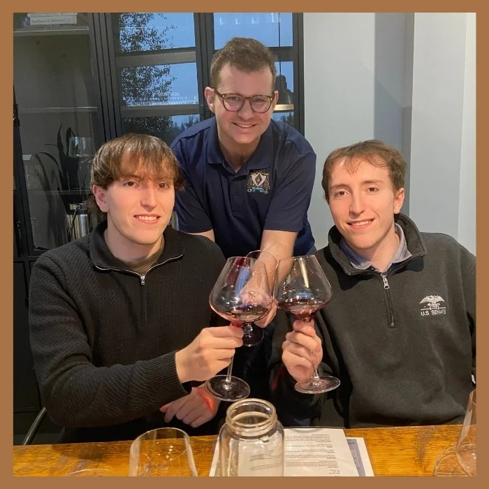3 guys wine wine glasses cheers