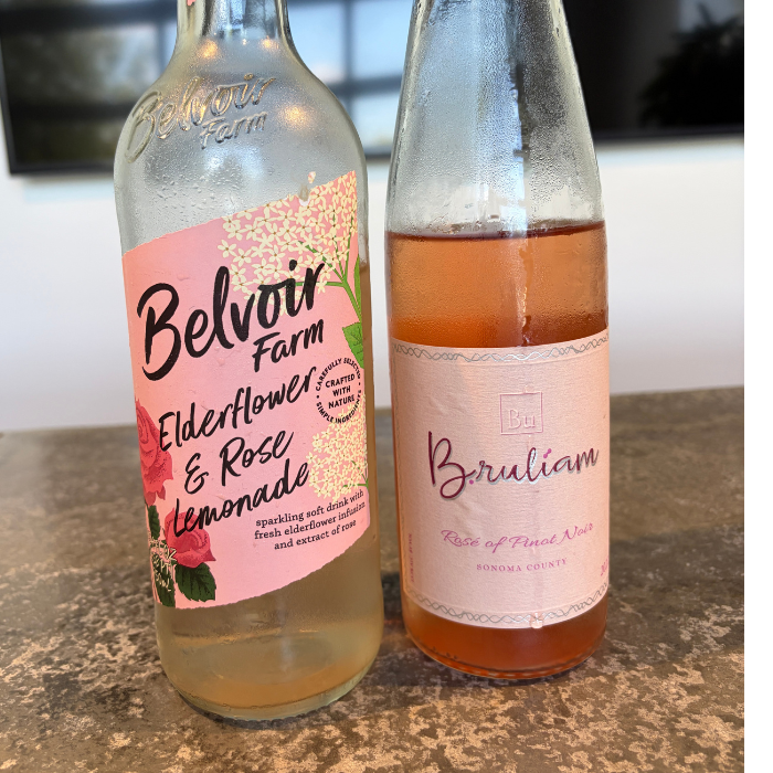 Bottle of flavored lemonade and bottle of rose