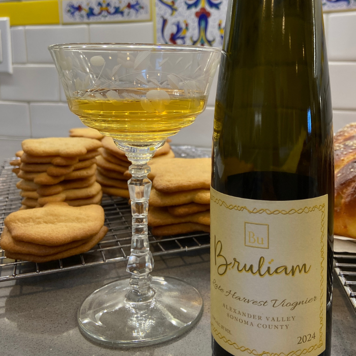 bottle of dessert wine with coupe glass