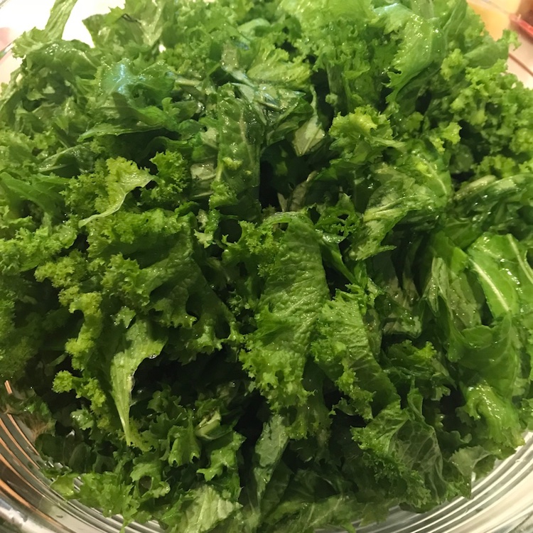 a mountain of mustard greens