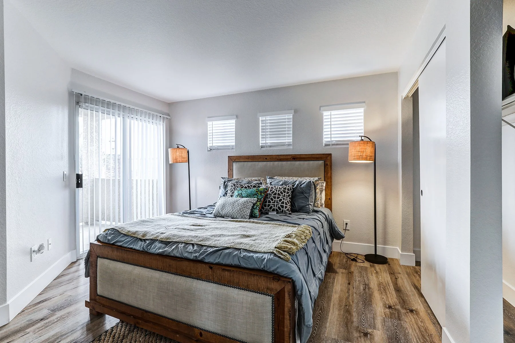 A two-bedroom model unit at Villagio, this image shows the primary bedroom. 