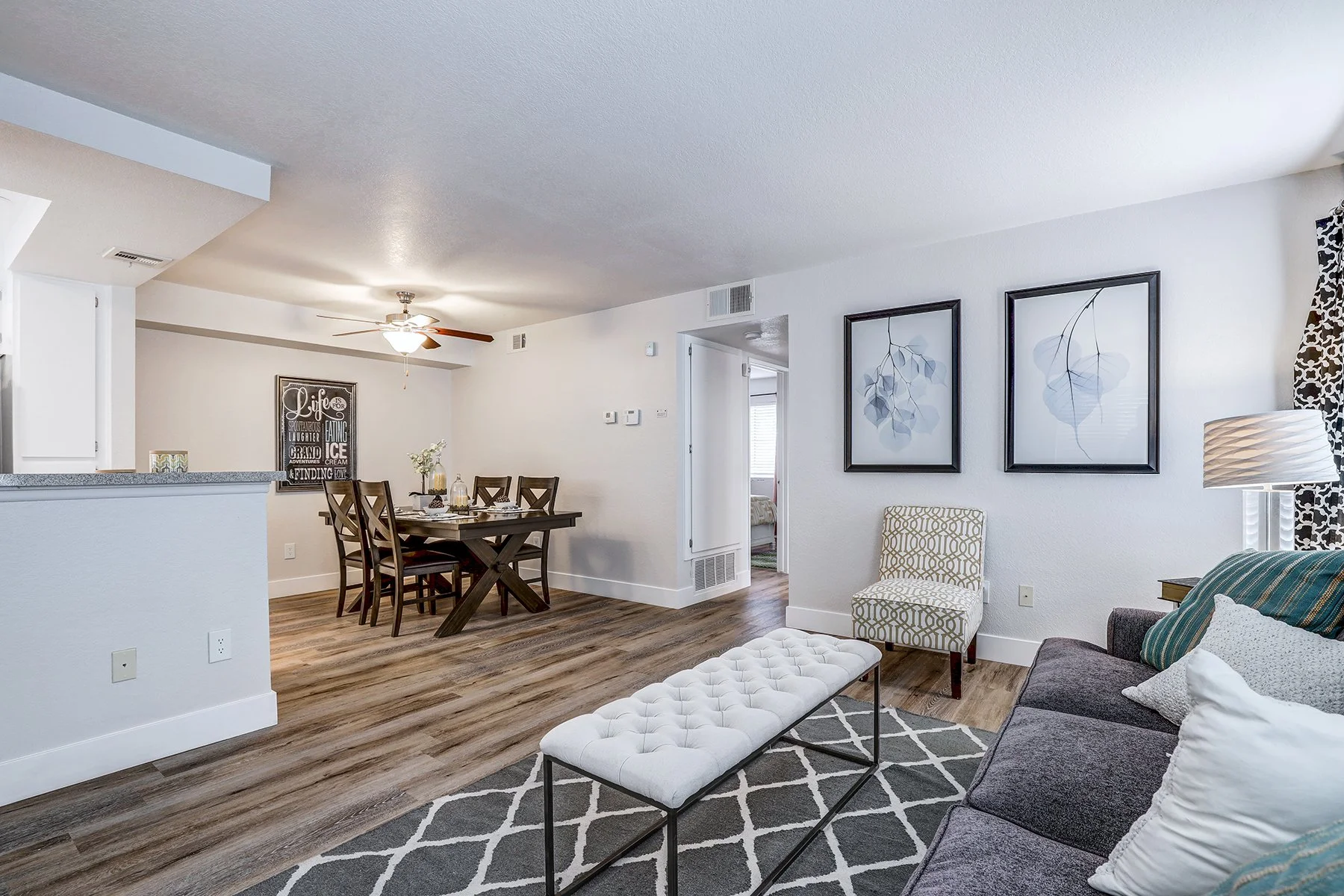 A two-bedroom model unit at Villagio, this image shows the living/dining room. 