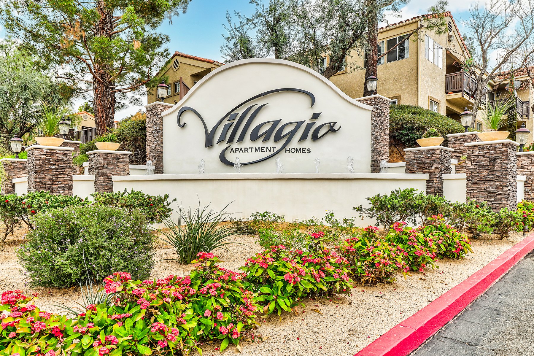 The tranquil fountain in the from of Villagio surround by beautiful flowers