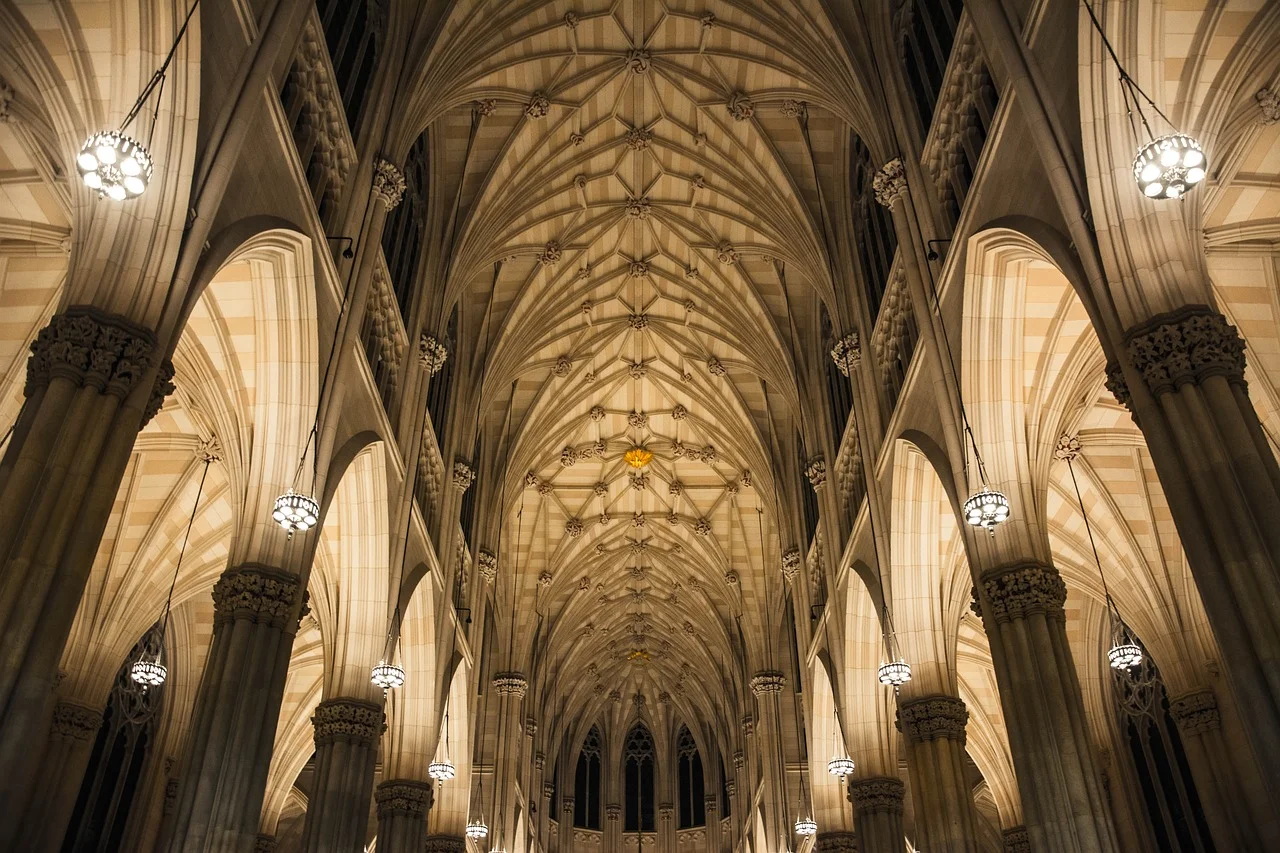 Example of the interior of gothic architecture. In the image we can see the Nave which leads to the Ambulatory. On the sides we see Pointed Arches held up by Piers and reinforced by Ribbing.