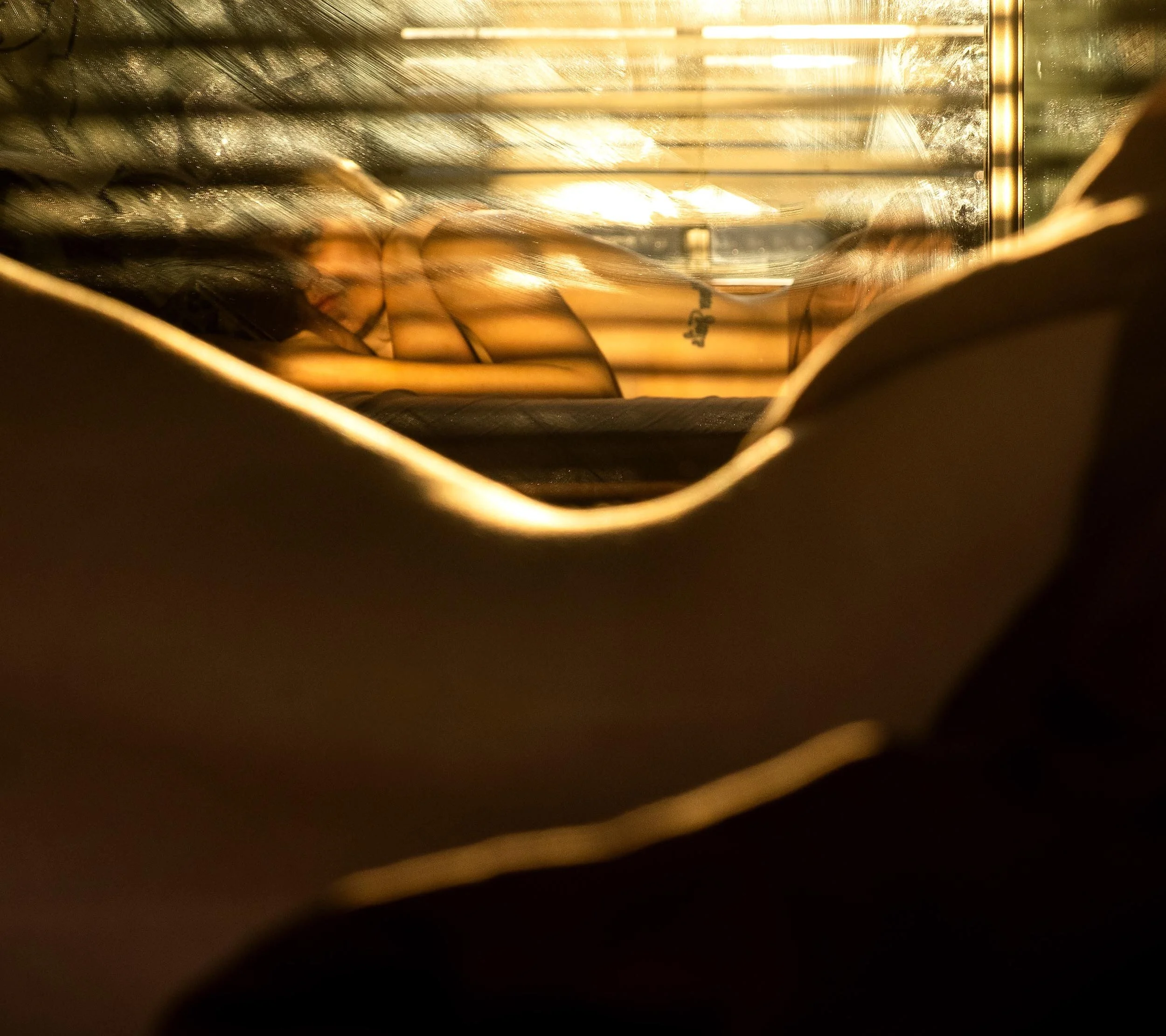  I am beginning to loathe the blinds in my apartment. Another sunrise behind bars. Isolation self-portrait, May 3, 2020. Laura Pedersen Photo 