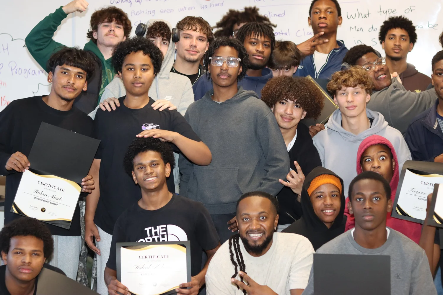 Young people gather with certificates after a Tune In Foundation youth leadership workshop.