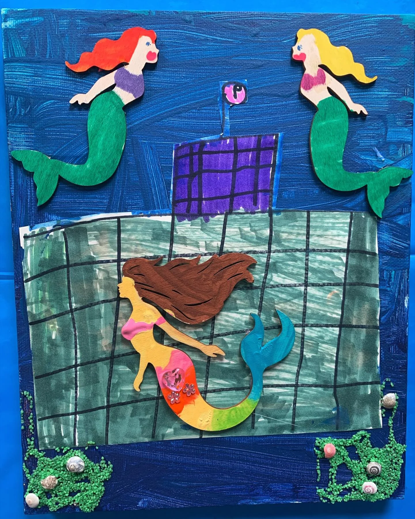 Mermaids and their castle 🧜🏻&zwj;♀️🧜🏻&zwj;♀️🧜🏻&zwj;♀️. Penny, age 6. Paint, paper, wood, sand, shells, marker, &amp; gems on canvas kidsart #mermaidart