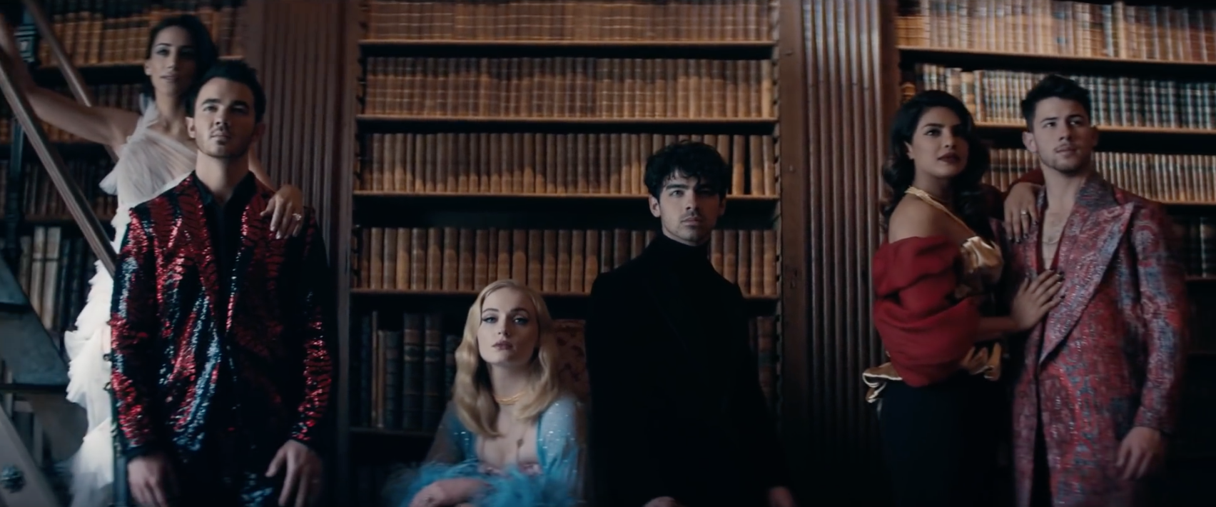 A still of the royal family from the music video for “Sucker.” From left: Danielle Jonas, Kevin Jonas, Sophie Turner, Joe Jonas, Priyanka Chopra Jonas, and Nick Jonas