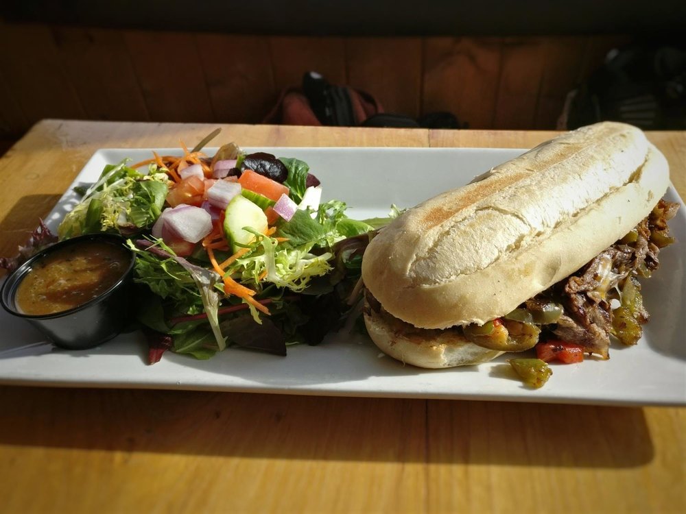 The Philly Cheese Steak sandwich takes a Canadian slopeside twist at WH20 near Nelson, British Columbia, Canada. © Ski Travel Go