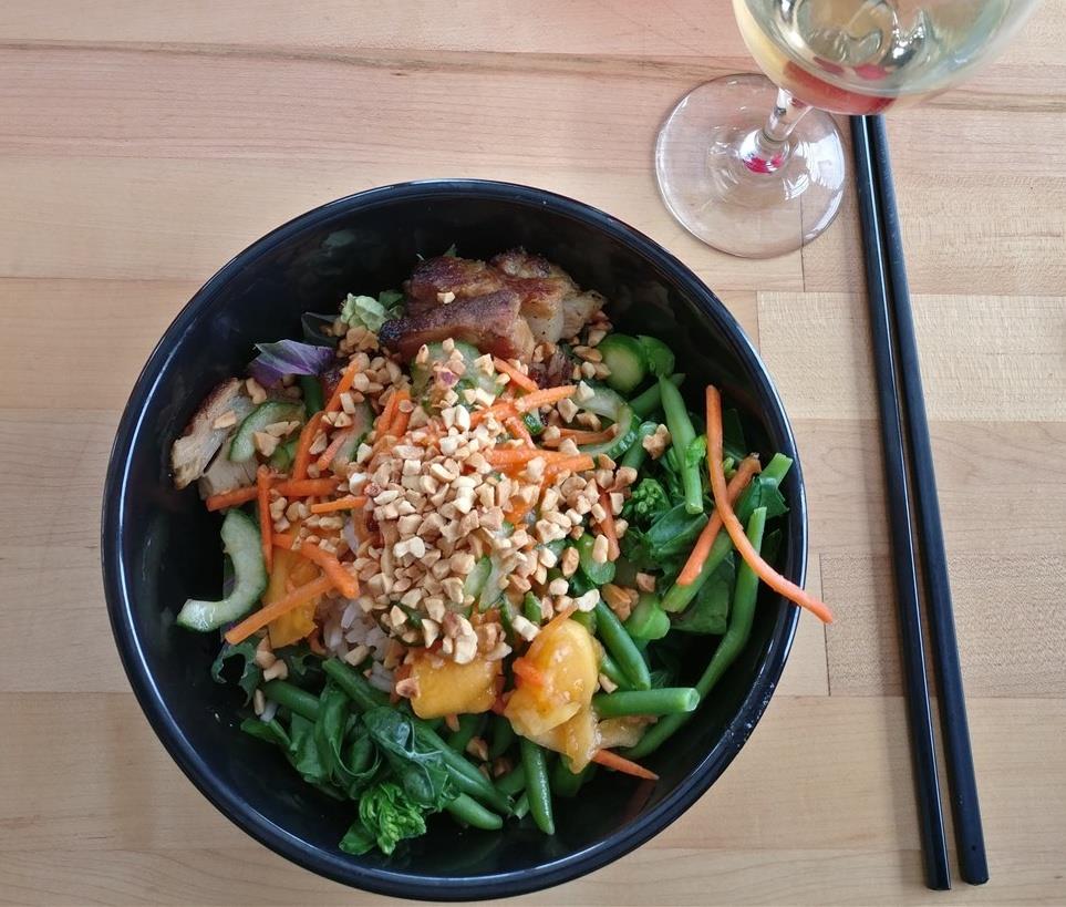 Inspired by Southeast Asian cuisine, this yumsville rice bowl is customized for each diner at the wok station in the fast casual servery at Rendezvous Lodge atop Blackcomb Mountain. © Ski Travel Go