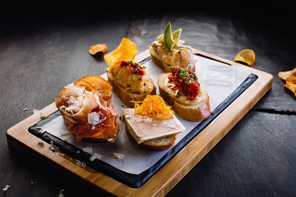  Montaditos are delicious and creative little sandwiches elemental to true Spanish tapas.  Bar Oso 's line-up includes a montadito of matane shrimp with avocado and yuzu, another of duck liver parfait with orange zest, a glorified ham and cheese with