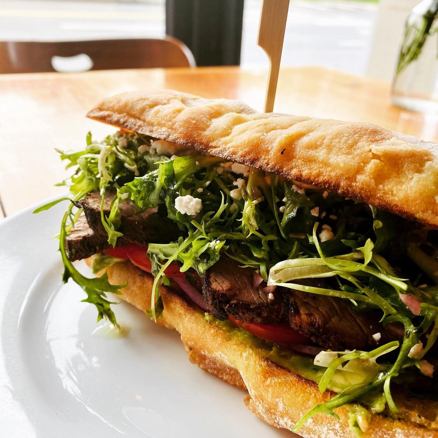 Today&rsquo;s special: Grilled tri tip on ciabatta with guacamole, red onion, tomato, fris&eacute;e, goat cheese and chimichurri.