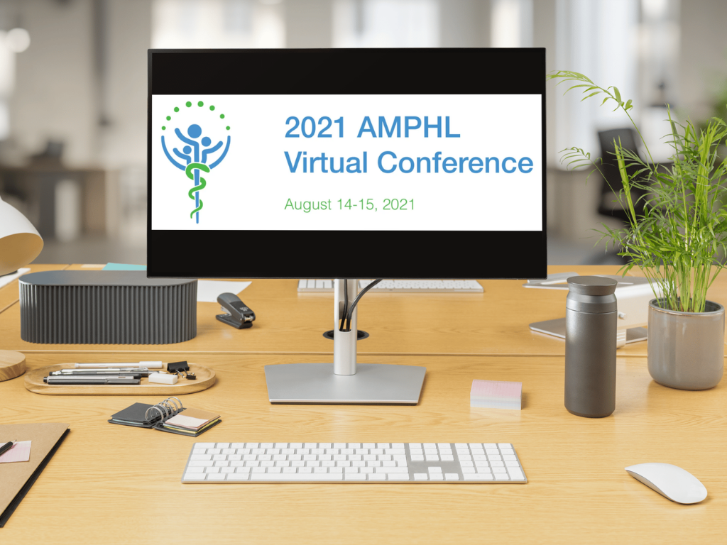 a pic of a laptop on a desk. On the laptop screen is a white background that says 2021 AMPHL Virtual Conference August 14-15