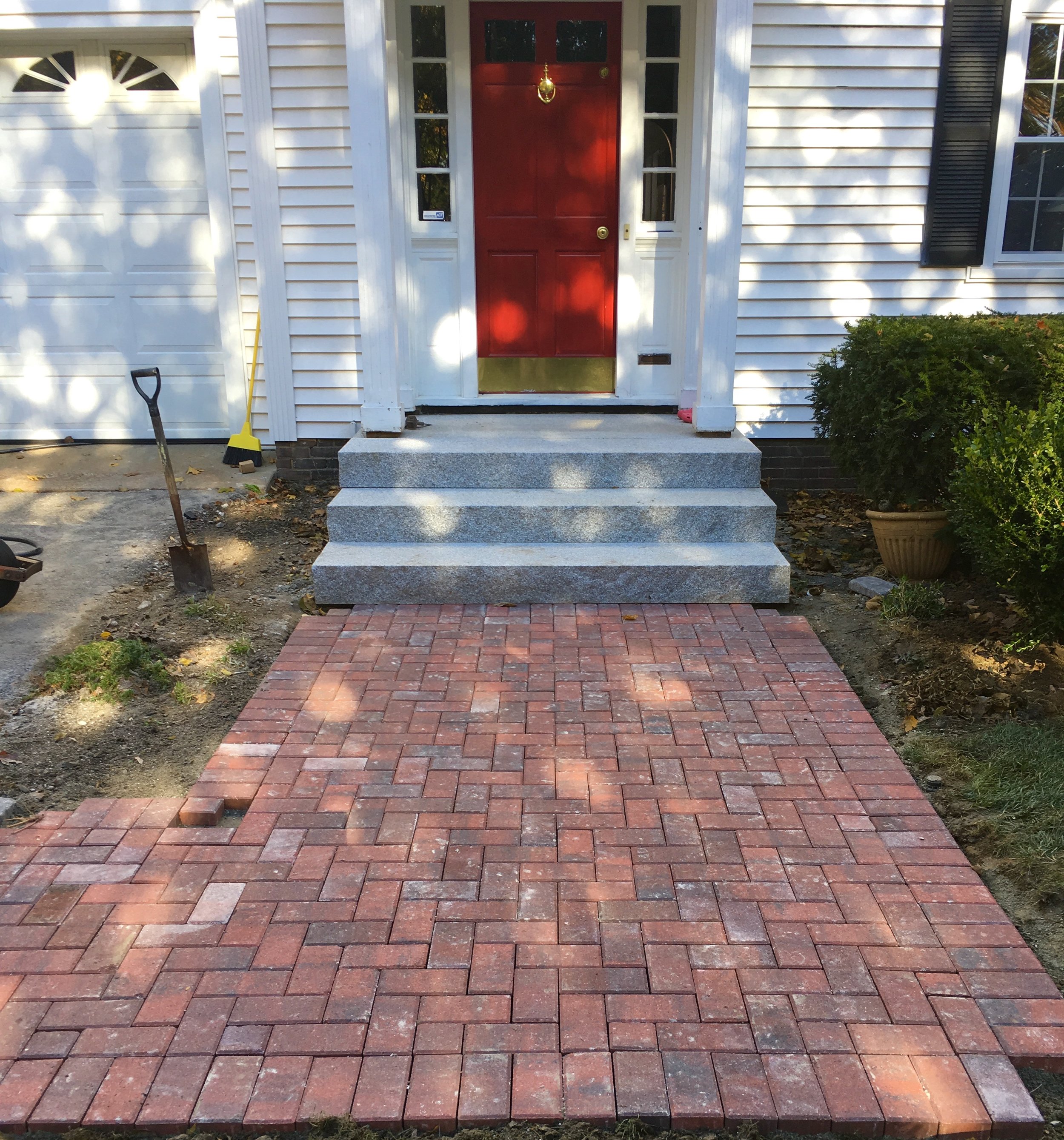 A couple of bricks to cut and this elegant front walkway is complete!