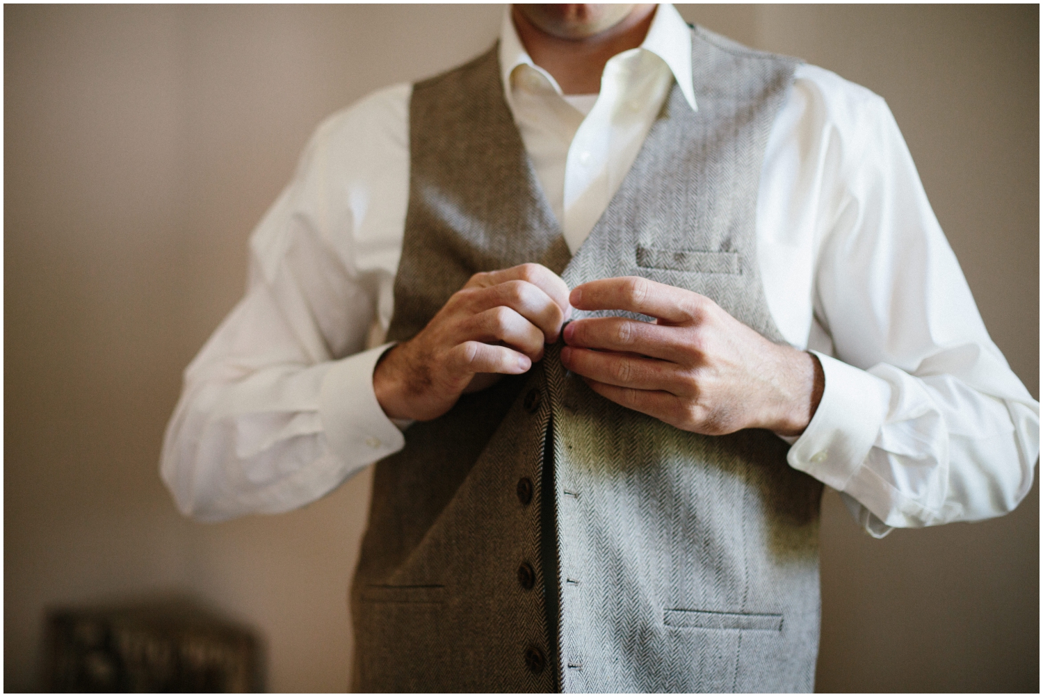 Groom getting ready for his wedding at Stonebridge
