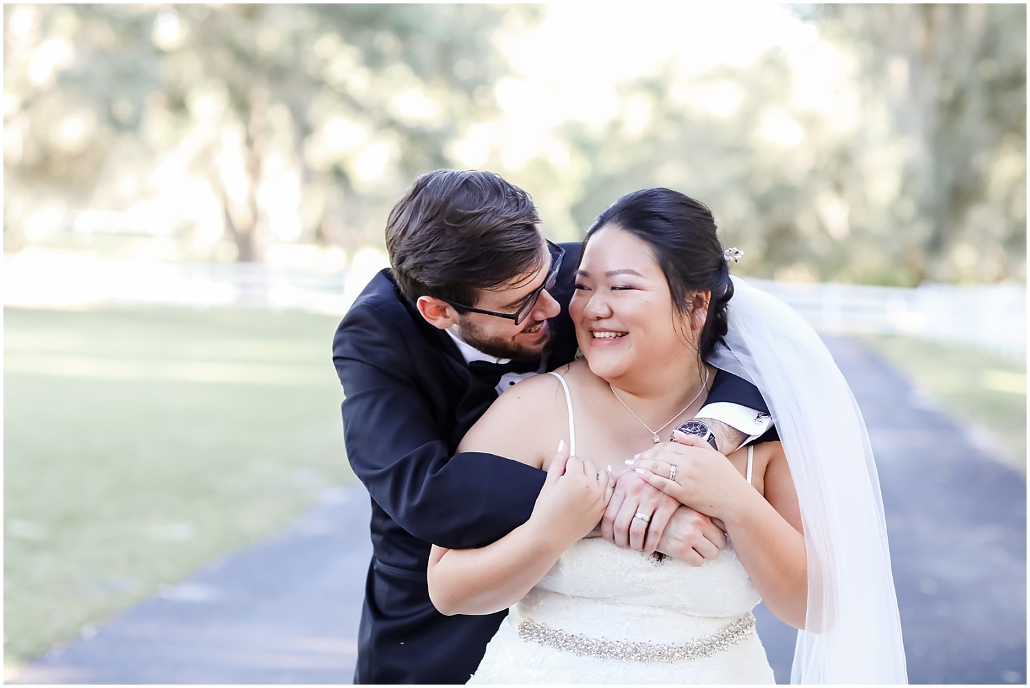 bride and groom hugging and smiling