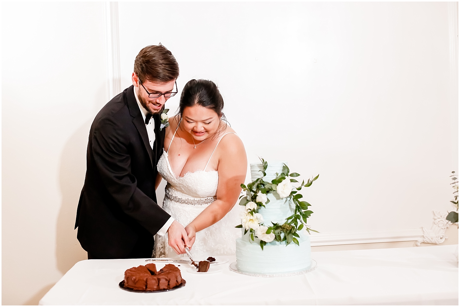 bride and groom cutting the cake