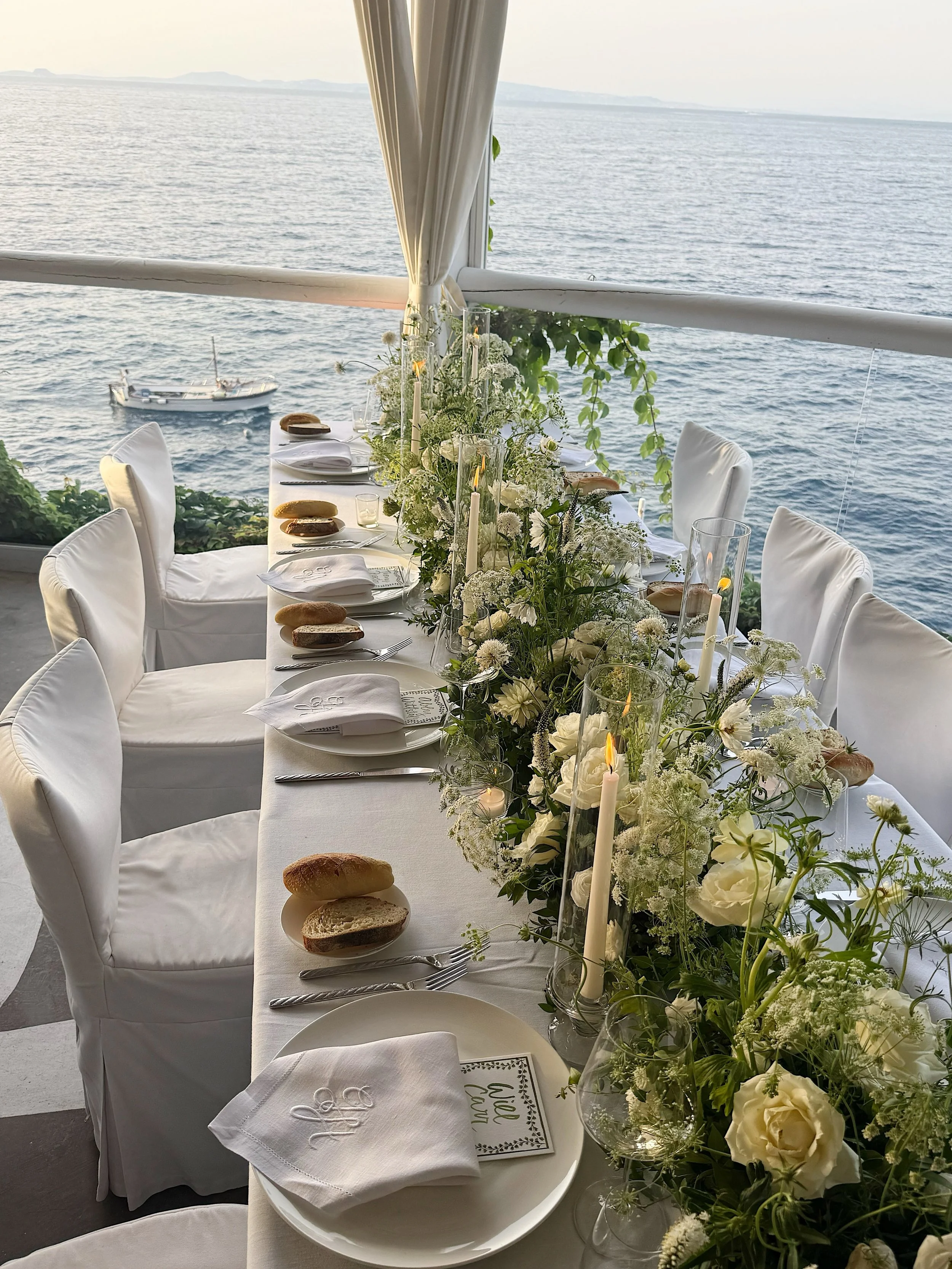 Il Riccio Wedding Reception 

Elegant, Italian wedding reception @ilricciocapri. From the beautiful flowers, monogrammed napkins, delicious food, fireworks, opera singer, cocktails, @ruinart champagne, rooftop dancing, and late night pizzas, this was