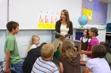 Boy with phonological disorder in classroom; treated at Canto Speech Therapy Online
