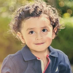 Little boy looking and thinking; language development at Canto Speech Therapy Online